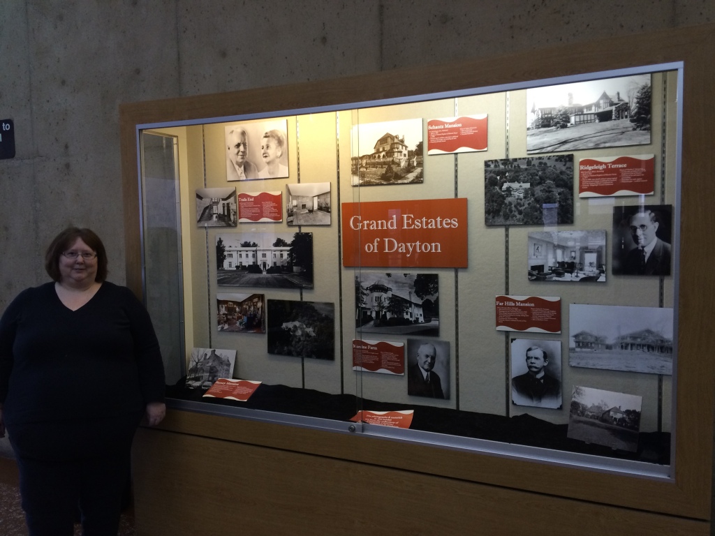 Nina Herzog with her exhibit, "Grand Estates of Dayton," Dec. 2014.