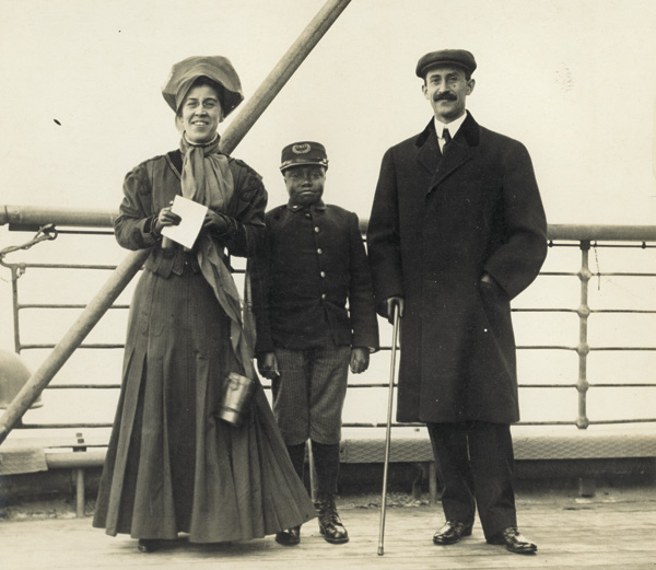 Katharine and Orville Wright standing with a cabin boy on the deck of the German ocean liner "S. S. Kronprinzessin Cecilie" during their trip to Europe, 1909. (photo ms1_29_2_12)