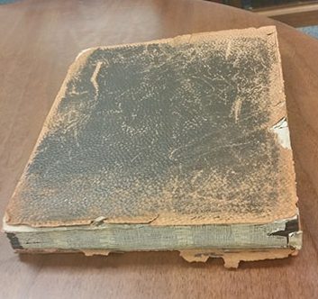 Ft. Myer Album showing leather cover and spine with significant losses and abrasions. 