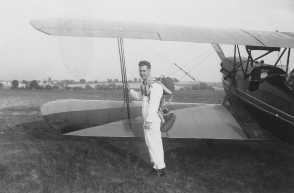 Quentin Honnert next to airplane, undated